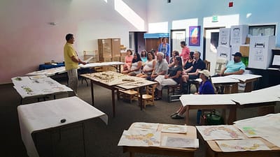Final presentation at the current Waldorf school in Reno. Models and an architectural study of the school campus are displayed on the tables.